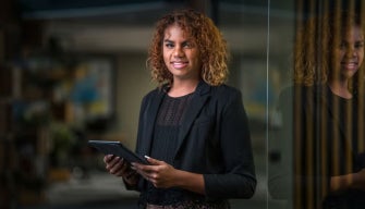 A social worker meets with a client in a professional office, illustrating what social workers earn in Australia