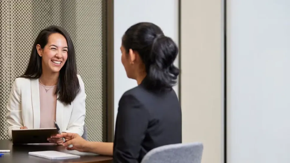 A warm counsellor sits with a client illustrating the journey of becoming a counsellor in Australia
