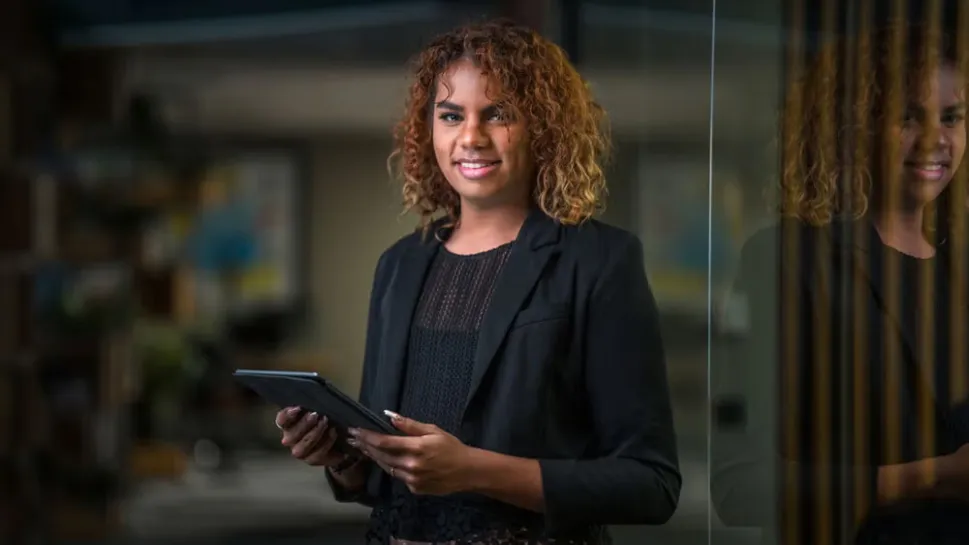 A social worker meets with a client in a professional office, illustrating what social workers earn in Australia