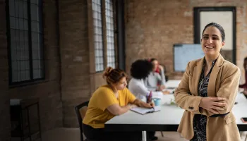 Blind woman leading a team in corporate office